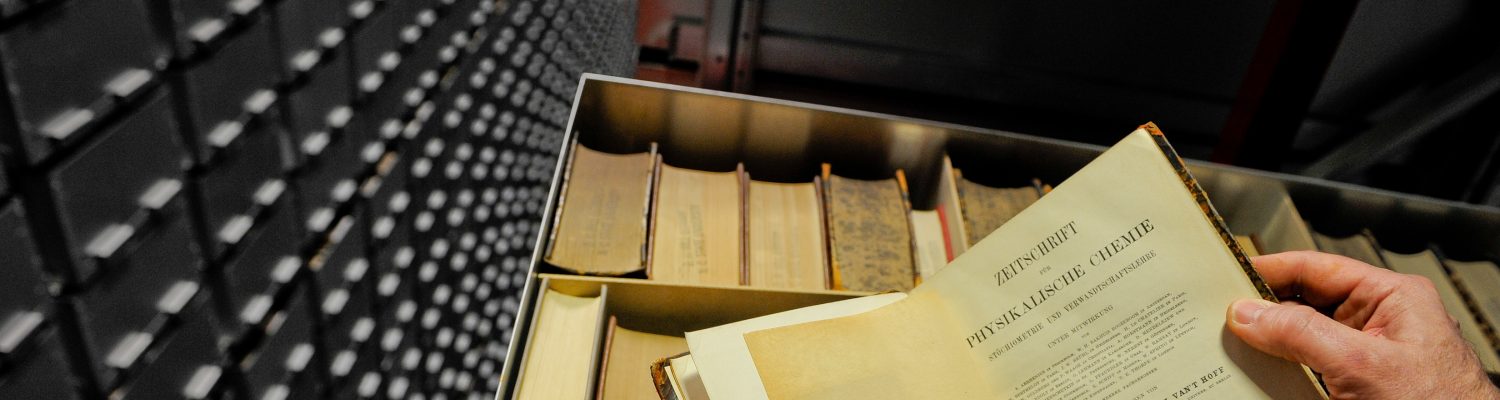 Books are loaded and unloaded onto the book bot at the James B. Hunt Library. Photo by Marc Hall